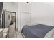 This bedroom features wood-look flooring and a double door closet for ample storage at 2576 R E Byrd Rd, Frostproof, FL 33843