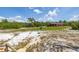 Home exterior as seen from a high vantage point, offering a clear view of the house, lot and solar panels at 2576 R E Byrd Rd, Frostproof, FL 33843
