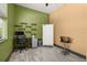 Flex room features a computer desk and fridge, offering versatility for an office or additional storage at 2576 R E Byrd Rd, Frostproof, FL 33843