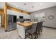 Modern kitchen with stainless steel appliances, a wood-top island and barstool seating at 2576 R E Byrd Rd, Frostproof, FL 33843