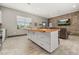 Stylish kitchen with a large wood-top island, white cabinetry, and stainless steel appliances at 2576 R E Byrd Rd, Frostproof, FL 33843