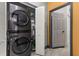 This laundry area features a stacked washer and dryer for space saving convenience at 2576 R E Byrd Rd, Frostproof, FL 33843
