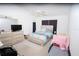 Bright bedroom with a ceiling fan, neutral carpet, and ample natural light at 2773 Woodstream Cir, Kissimmee, FL 34743