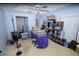 Bright bedroom featuring ample display shelving, ceiling fan, and neutral carpet at 2773 Woodstream Cir, Kissimmee, FL 34743