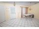 Open dining area with tile flooring, a modern table set, and neutral wall colors at 2773 Woodstream Cir, Kissimmee, FL 34743