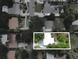 Aerial view of a neighborhood with mature trees and lush landscaping, focusing on property at 2900 Wessex St, Orlando, FL 32803
