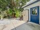 Cozy backyard patio area with plants and a storage shed next to the back entrance of the home at 2900 Wessex St, Orlando, FL 32803
