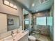 Modern bathroom featuring a glass-enclosed shower, floating vanity, and sleek fixtures at 2900 Wessex St, Orlando, FL 32803