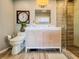 Well-lit bathroom showcasing a modern vanity, a sleek toilet, and a glass-enclosed shower at 2900 Wessex St, Orlando, FL 32803