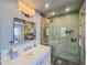 This modern bathroom showcases a glass enclosed shower and a bright vanity area at 2900 Wessex St, Orlando, FL 32803