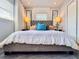 Relaxing bedroom featuring a gray bed with a tufted headboard and decorative pillows at 2900 Wessex St, Orlando, FL 32803