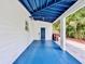 Spacious carport with painted flooring, and access door offering convenience and protection at 2900 Wessex St, Orlando, FL 32803