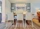Modern dining room with a bench seating area and decorative art at 2900 Wessex St, Orlando, FL 32803