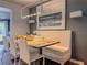 Bright dining room with seating bench and hardwood floors at 2900 Wessex St, Orlando, FL 32803