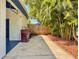 Driveway and yard with a gate and lush landscaping, adding beauty and privacy to the property at 2900 Wessex St, Orlando, FL 32803