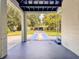 Charming entrance featuring blue painted floor and brick pathway, creating a welcoming first impression at 2900 Wessex St, Orlando, FL 32803