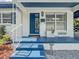 Stylish entryway features a bright blue door and decorative planters, creating a welcoming entrance at 2900 Wessex St, Orlando, FL 32803