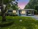 Charming home featuring a well-manicured lawn and a covered carport with parking at 2900 Wessex St, Orlando, FL 32803