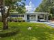 Charming home featuring a well-manicured lawn and a covered carport with parking at 2900 Wessex St, Orlando, FL 32803