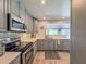 Bright kitchen with stainless steel appliances and countertops at 2900 Wessex St, Orlando, FL 32803
