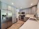 Bright kitchen featuring gray cabinets and stainless steel appliances at 2900 Wessex St, Orlando, FL 32803