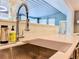 Close up of a modern kitchen sink with accessories and lighting at 2900 Wessex St, Orlando, FL 32803