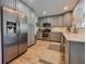 Stylish kitchen with stainless steel appliances and gray cabinetry at 2900 Wessex St, Orlando, FL 32803
