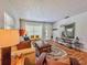 Bright and airy living room with hardwood floors, a cozy sofa, and modern decorative elements at 2900 Wessex St, Orlando, FL 32803