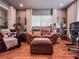 Comfortable living room featuring hardwood floors, a plush leather couch and guitars displayed on the wall at 2900 Wessex St, Orlando, FL 32803
