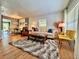 Open living area with hardwood floors, comfortable seating, and a seamless transition to the dining space at 2900 Wessex St, Orlando, FL 32803