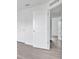 Bright bedroom features paneled doors and light wood-look flooring at 303 Anchovie Ct, Poinciana, FL 34759