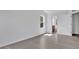 Bright bedroom featuring gray vinyl floors, natural light, and neutral-toned walls at 303 Anchovie Ct, Poinciana, FL 34759