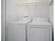 Laundry room features a standard washer and dryer at 303 Anchovie Ct, Poinciana, FL 34759