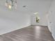 Bright living room with ample space and light wood-look flooring at 303 Anchovie Ct, Poinciana, FL 34759