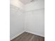 Walk-in closet with wire shelving and wood-look flooring at 303 Anchovie Ct, Poinciana, FL 34759