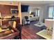 Open living space with kitchen, dining area, and view into bedroom at 3100 Parkway Blvd # 417, Kissimmee, FL 34747
