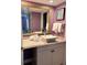 Modern bathroom featuring a vanity with granite counters, a vessel sink, and large mirror at 3100 Parkway Blvd # 521, Kissimmee, FL 34747