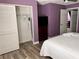 Bedroom featuring closet, dresser with TV, and doorway to additional rooms at 3100 Parkway Blvd # 521, Kissimmee, FL 34747
