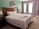 Comfortable bedroom featuring a king bed, fresh linens, and a serene ambiance at 3100 Parkway Blvd # 521, Kissimmee, FL 34747