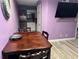 Dining area with table and view into kitchen featuring stainless steel appliances at 3100 Parkway Blvd # 521, Kissimmee, FL 34747