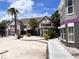 Condo buildings surrounded by a sandy area with palm trees and a gazebo at 3100 Parkway Blvd # 521, Kissimmee, FL 34747