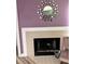 Tile fireplace and hearth with geometric style wall decor and furniture at 3100 Parkway Blvd # 521, Kissimmee, FL 34747