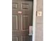 Apartment front door features a no smoking sticker and keyless lock at 3100 Parkway Blvd # 521, Kissimmee, FL 34747