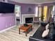 Living area with a fireplace and large picture window at 3100 Parkway Blvd # 521, Kissimmee, FL 34747