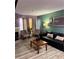 A contemporary living area is filled with natural light from the large picture window at 3100 Parkway Blvd # 521, Kissimmee, FL 34747