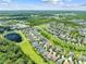 An aerial view of the neighborhood, highlighting its peaceful surroundings, community ponds, and lush green spaces at 3144 Dark Sky Dr, Harmony, FL 34773