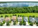 Beautiful aerial view of lakeside home, showcasing a large backyard and lush greenery at 3144 Dark Sky Dr, Harmony, FL 34773