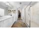 Modern bathroom features double vanity, walk-in shower, and walk-in closet access at 3144 Dark Sky Dr, Harmony, FL 34773
