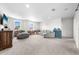 Spacious bonus room with plush carpeting, a comfortable sofa, and lots of natural light at 3144 Dark Sky Dr, Harmony, FL 34773