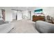 Upstairs bonus room, featuring a lounge area with sofa and mounted television at 3144 Dark Sky Dr, Harmony, FL 34773